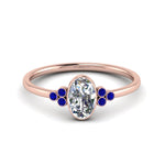 Load image into Gallery viewer, petite-bezel-set-oval-shaped-diamond-engagement-ring-with-sapphire-in-rose-gold-FD9175OVRGSABL-NL-RG