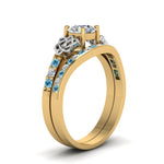 Load image into Gallery viewer, round-cut-diamond-channel-band-celtic-bridal-set-with-blue-topaz-in-14K-yellow-gold-FDENS2255B2ROGICBLTOANGLE2-NL-YG_354e5b4d-1886-422d-a790-03c5589c1305?v=1756980511