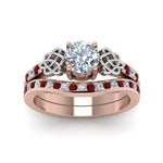 Load image into Gallery viewer, round-cut-diamond-channel-band-celtic-bridal-set-with-ruby-in-14K-rose-gold-FDENS2255B2ROGRUDRANGLE5-NL-RG_9488cabb-b8cb-4fb4-95a1-9043a3d9f2a0?v=1756980511
