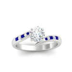 Load image into Gallery viewer, round-cut-diamond-swirl-channel-set-sapphire-wedding-ring-in-white-gold-FDENS4028RORGSABLANGLE5-NL-WG_168fafba-b4d6-47e5-8524-27d80120562b.jpg?v=1754996175
