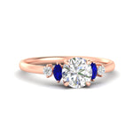 Load image into Gallery viewer, round-cut-marquise-and-round-accented-sapphire-engagement-ring-in-rose-gold-fdenr11621rogsablsleep-nl-rg_c671a614-c13e-403a-bbfb-6f912c0d578e.jpg?v=1766474255
