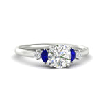 Load image into Gallery viewer, round-cut-marquise-and-round-accented-sapphire-engagement-ring-in-white-gold-fdenr11621rogsablsleep-nl-wg_6c565bd3-7290-44c5-8875-b0ee5d67eabd.jpg?v=1766474255