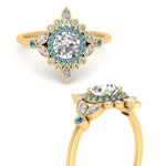 Load image into Gallery viewer, round-halo-floral-blue-topaz-engagement-ring-in-yellow-gold-FD9822RORGICBLTOANGLE3-NL-YG?v=1755852218