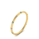 Load image into Gallery viewer, thin-space-out-stackable-diamond-band-with-blue-topaz-in-yellow-gold-FDEWB9437RORGICBLTOANGLE2-NL-YG