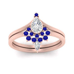 Load image into Gallery viewer, tiara-pear-bezel-sapphire-wedding-ring-set-in-rose-gold-FD1046PEGSABLANGLE5-NL-RG_0362c9ad-4825-424c-acfe-41236bbec818?v=1761911441