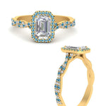Load image into Gallery viewer, vine-emerald-cut-halo-blue-topaz-engagement-ring-in-yellow-gold-FD9126EMRGICBLTOANGEL3-NL-YG_bee2240d-f3cc-4b3a-8494-c3c41590e595?v=1757924902