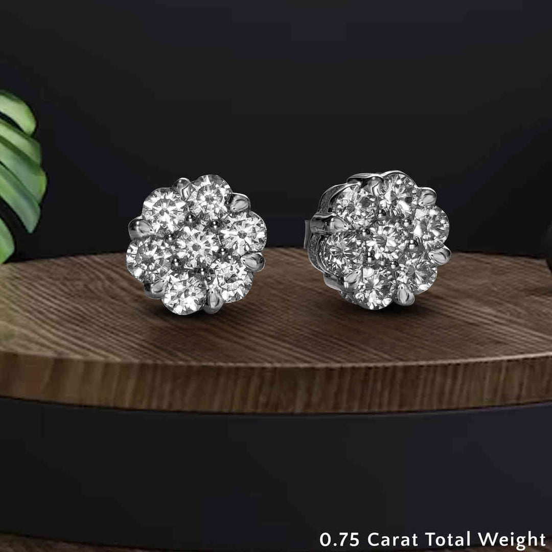 https://cdn.fascinatingdiamonds.com/FDEAR1081/flower-diamond-earring-two-tone-seven-stone-0.75-carat-in-white-gold-FDEAR10840-0.75CTANGLE2-NL-WG.jpg
