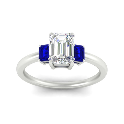 0.25-ct-emerald-cut-three-stone-sapphire-engagement-ring-in-white-gold-fdenr9299emgsablangle5-0.25ct-nl-wg.jpg
