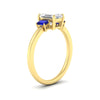 Load image into Gallery viewer, 0.25-ct-emerald-cut-three-stone-sapphire-engagement-ring-in-yellow-gold-fdenr9299emgsablangle2-0.25ct-nl-yg.jpg