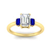 Load image into Gallery viewer, 0.25-ct-emerald-cut-three-stone-sapphire-engagement-ring-in-yellow-gold-fdenr9299emgsablangle5-0.25ct-nl-yg.jpg