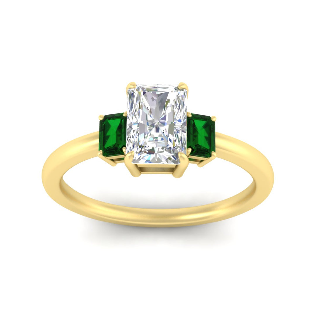 0.25-ct-radiant-cut-three-stone-emerald-engagement-ring-in-yellow-gold-fdenr9299ragemgrangle5-0.25ct-nl-yg.jpg