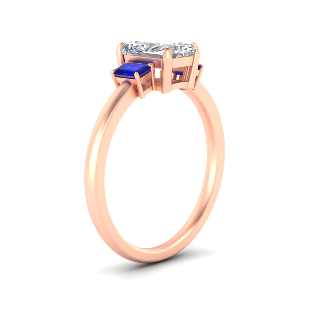 0.25-ct-radiant-cut-three-stone-sapphire-engagement-ring-in-rose-gold-fdenr9299ragsablangle2-0.25ct-nl-rg.jpg