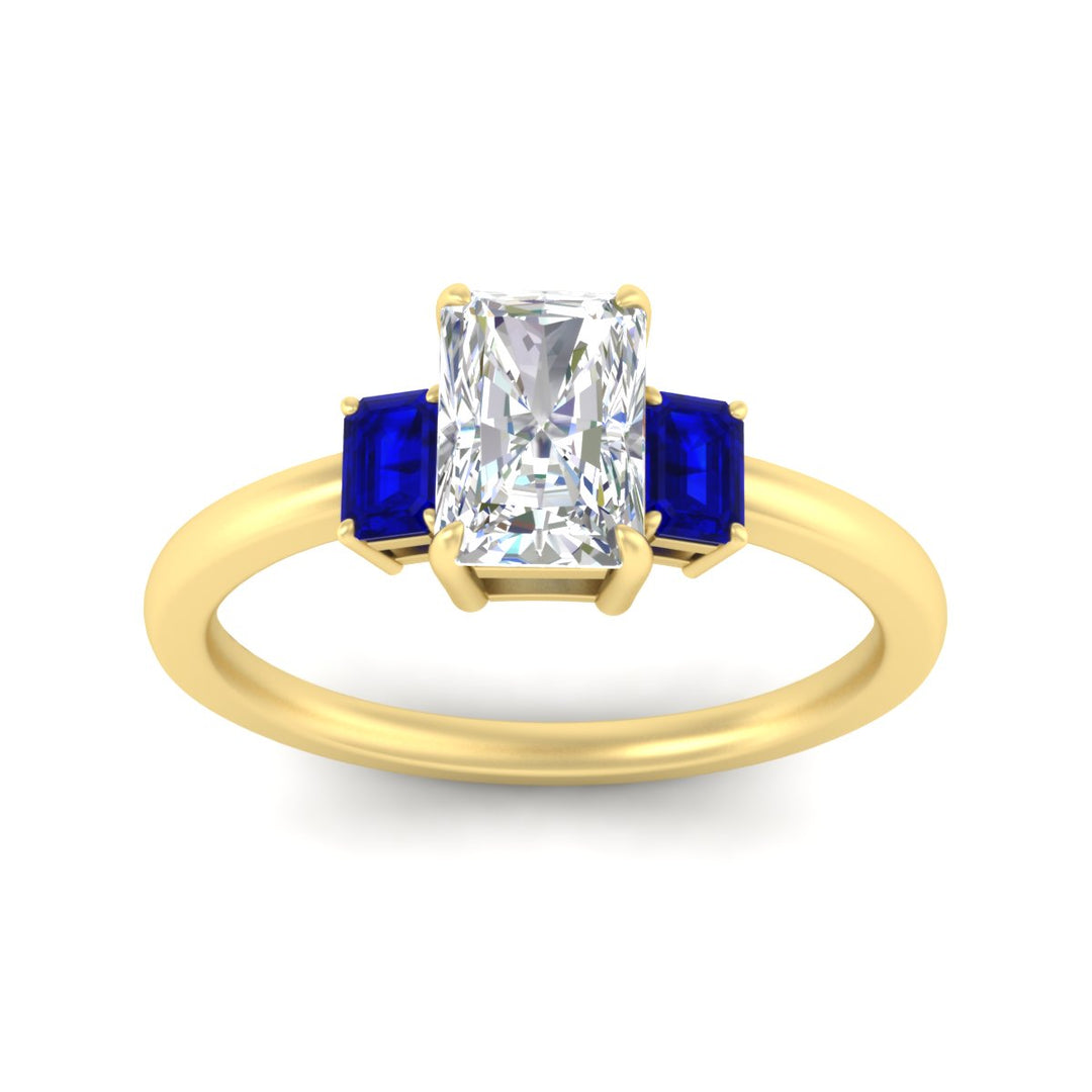 0.25-ct-radiant-cut-three-stone-sapphire-engagement-ring-in-yellow-gold-fdenr9299ragsablangle5-0.25ct-nl-yg.jpg