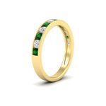 Load image into Gallery viewer, 0.75-carat-round-diamond-channel-set-anniversary-ring-with-emerald-in-yellow-gold-FDWB5242ROGEMGRANGLE2-0.75CT-NL-YG
