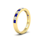 Load image into Gallery viewer, 0.75-carat-round-diamond-channel-set-anniversary-ring-with-sapphire-in-yellow-gold-FDWB5242ROGSABLANGLE2-0.75CT-NL-YG
