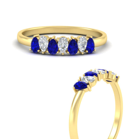 https://cdn.fascinatingdiamonds.com/fdwb8008/0.75-carat-terdrop-seven-stone-wedding-sapphire-band-in-yellow-gold-fdwb8008pegsablangle3-0.75ct-nl-yg.jpg