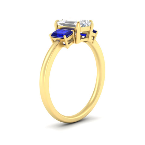 0.75-ct-emerald-cut-three-stone-sapphire-engagement-ring-in-yellow-gold-fdenr9299emgsablangle2-0.75ct-nl-yg.jpg