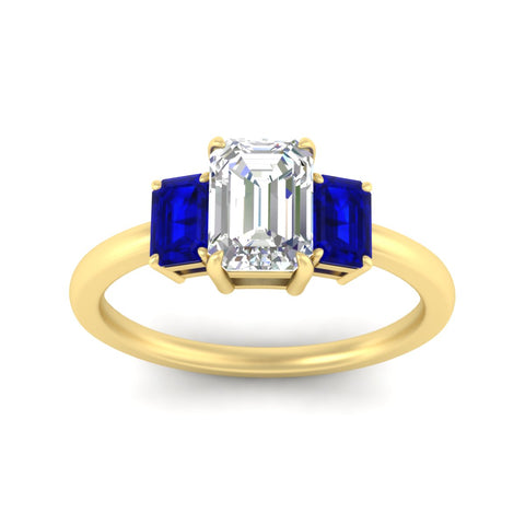 0.75-ct-emerald-cut-three-stone-sapphire-engagement-ring-in-yellow-gold-fdenr9299emgsablangle5-0.75ct-nl-yg.jpg