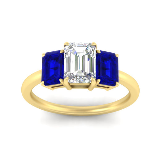 1.00-ct-emerald-cut-three-stone-sapphire-engagement-ring-in-yellow-gold-fdenr9299emgsablangle5-1.00ct-nl-yg.jpg