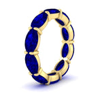 Load image into Gallery viewer, 10-carat-sapphire-eternity-wedding-band-oval-shape-in-yellow-gold-FDEWB8425OVGSABLANGLE2-10.00CT-NL-YG
