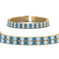 Thumbnail 50 - 2-row-round-tennis-diamond-bracelet-with-blue-topaz-in-yellow-gold-FDBRC9701GICBLTOANGLE1-NL-YG