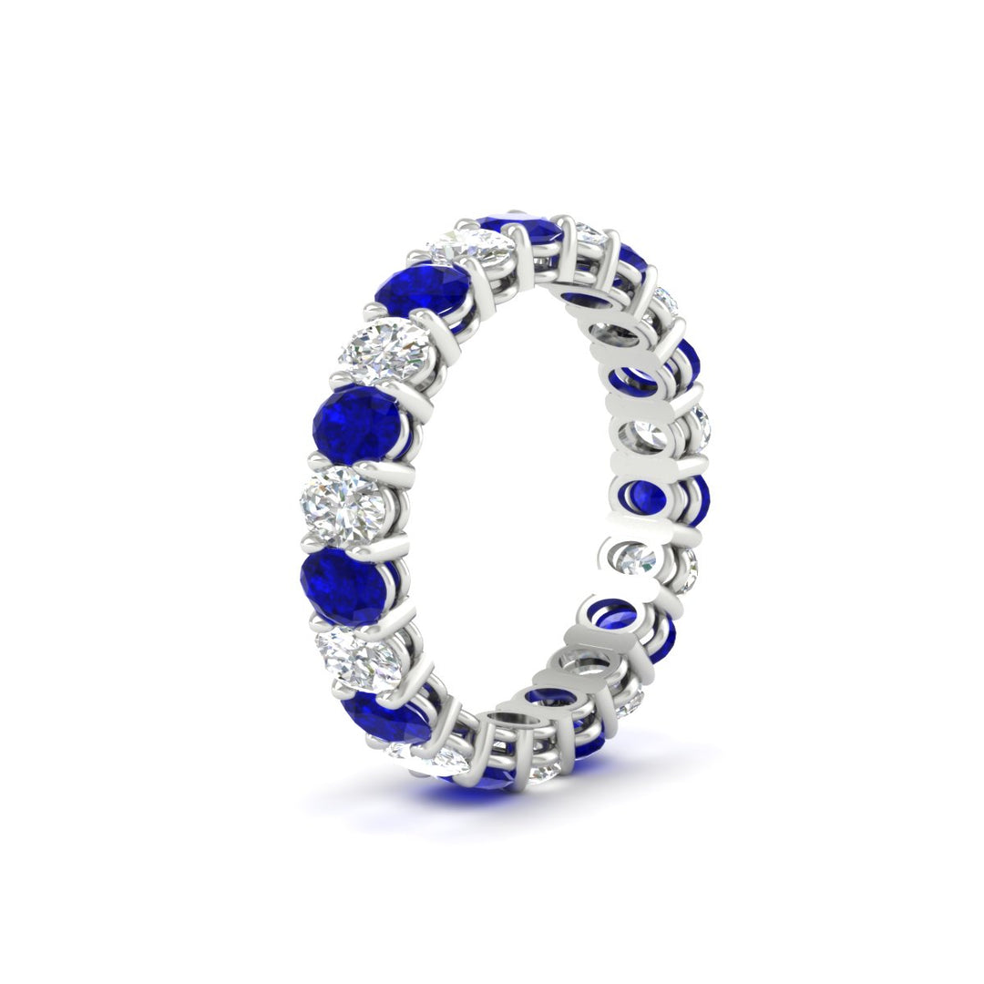 3-carat-oval-diamond-full-eternity-band-with-blue-saphhire-in-white-gold-fdewb8324ovgsablangle2-4.00x3.00mm-nl-wg