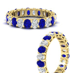 Load image into Gallery viewer, 3-carat-oval-diamond-full-eternity-band-with-blue-saphhire-in-yellow-gold-fdewb8324ovgsablangle3-4.00x3.00mm-nl-yg