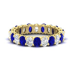 Load image into Gallery viewer, 3-carat-oval-diamond-full-eternity-band-with-blue-saphhire-in-yellow-gold-fdewb8324ovgsablsleep-4.00x3.00mm-nl-yg