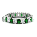 Load image into Gallery viewer, 3-carat-oval-diamond-full-eternity-band-with-emerald-in-white-gold-fdewb8324ovgemgrsleep-4.00x3.00mm-nl-wg-hw