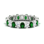 Load image into Gallery viewer, 3-carat-oval-diamond-full-eternity-band-with-emerald-in-white-gold-fdewb8324ovgemgrsleep-4.00x3.00mm-nl-wg