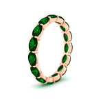 Load image into Gallery viewer, 3-carat-oval-emerald-eternity-ring-in-rose-gold-FDEWB8425OVGEMGRANGLE2-3.00CT-NL-RG