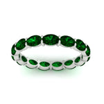 Load image into Gallery viewer, 3-carat-oval-emerald-eternity-ring-in-white-gold-FDEWB8425OVGEMGRANGLE5-3.00CT-NL-WG