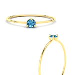Load image into Gallery viewer, 3-prong-round-blue-topaz-tiny-band-ring-in-yellow-gold-fd9389gicbltoangle3-nl-yg.jpg?v=1756441995
