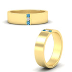 Load image into Gallery viewer, 3-stone-blue-topaz-wedding-anniversary-band-for-men-in-yellow-gold-fdm8111bgicbltoangle3-nl-yg.jpg
