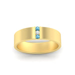 Load image into Gallery viewer, 3-stone-blue-topaz-wedding-anniversary-band-for-men-in-yellow-gold-fdm8111bgicbltoangle5-nl-yg.jpg
