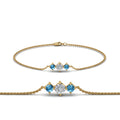 Thumbnail 83 - 3-stone-bracelet-for-mothers-with-blue-topaz-in-yellow-gold-FDBRC8693GICBLTOMD-NL-YG