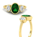 Thumbnail 2 - 3-stone-oval-bezel-emerald-engagement-ring-in-yellow-gold-fd11546gemgr-nl-yg