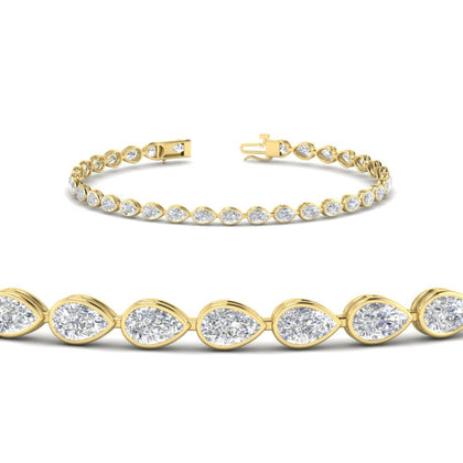 3.30-ct-pear-shape-east-west-bezel-diamond-tennis-bracelet-in-yellow-gold-FDBRCPE10581ANGLE2-3.30CT-NL-YG.jpg?v=1776840892