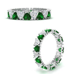 Load image into Gallery viewer, 4-carat-heart-eternity-diamond-anniversary-band-with-emerald-in-white-gold-FDEWB8439GEMGRANGLE3-NL-WG
