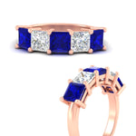 Load image into Gallery viewer, 5-carat-princess-cut-sapphire-wedding-band-for-women-in-rose-gold-fdwb8008prgsablangle3-5.00ct-nl-rg.jpg?v=1773654337