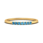Load image into Gallery viewer, 7-stone-stacking-blue-topaz-wedding-band-in-yellow-gold-FD122844BGICBLTOANGLE3-NL-YG-GS.jpg

