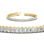 Load image into Gallery viewer, 8.70-carat-emerald-diagonal-tennis-bracelet-in-yellow-gold-fdbrc11518angle2-8-70-ct-nl-yg.jpg?v=1764931722
