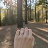Load image into Gallery viewer, Curved bagutte band with oval diamond 