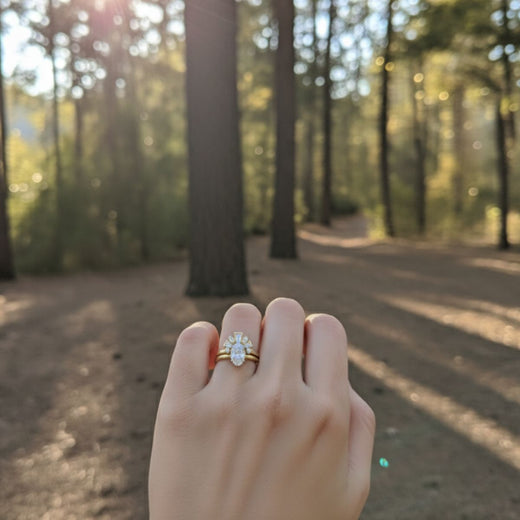 Curved bagutte band with oval diamond 