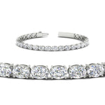 Load image into Gallery viewer, oval-shaped-13-carat-basket-tennis-bracelet-in-white-gold-fdbrc10444angle2-13.00-ct-nl-wg
