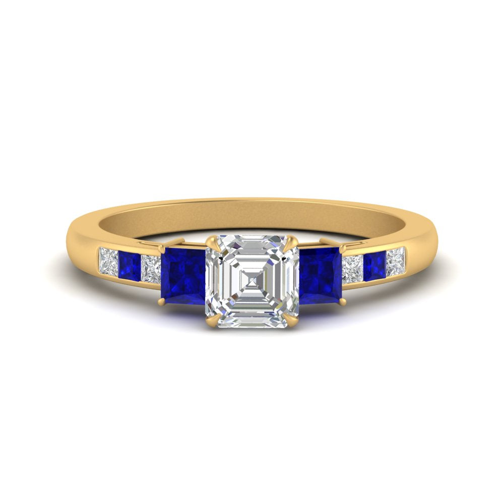 asscher-cut-channel-three-stone-diamond-engagement-ring-with-sapphire-in-yellow-gold-FDENS205ASRGSABL-NL-YG.jpg