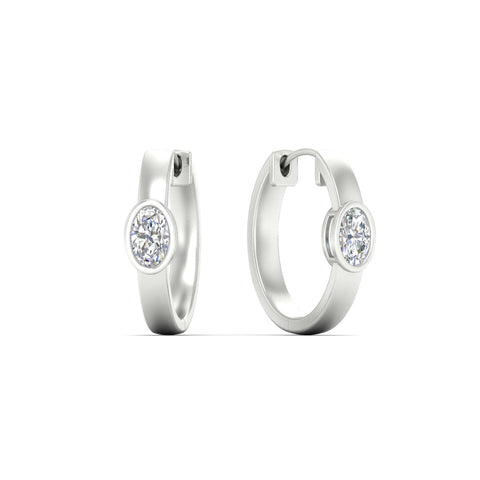 bezel-oval-diamond-huggie-hoop-earrings-in-white-gold-fdear11743ovangle1-nl-wg.jpg?v=1778041211