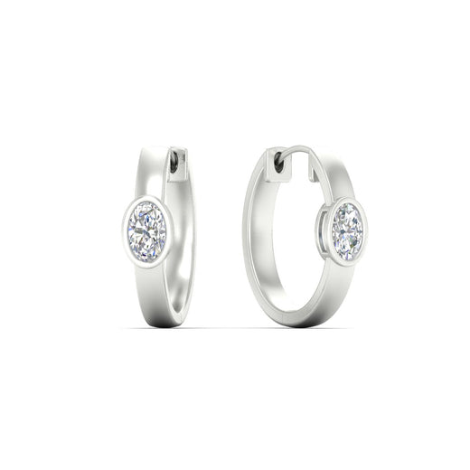 bezel-oval-diamond-huggie-hoop-earrings-in-white-gold-fdear11743ovangle1-nl-wg.jpg?v=1778041211