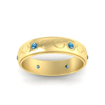 Load image into Gallery viewer, bezel-set-blue-topaz-mens-wedding-band-in-yellow-gold-fdm1284gicbltoangle5-nl-yg
