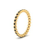 Load image into Gallery viewer, bezel-set-round-black-diamond-stacking-band-in-yellow-gold-FDEWB11036GBLACKANGLE3-NL-YG.jpg
